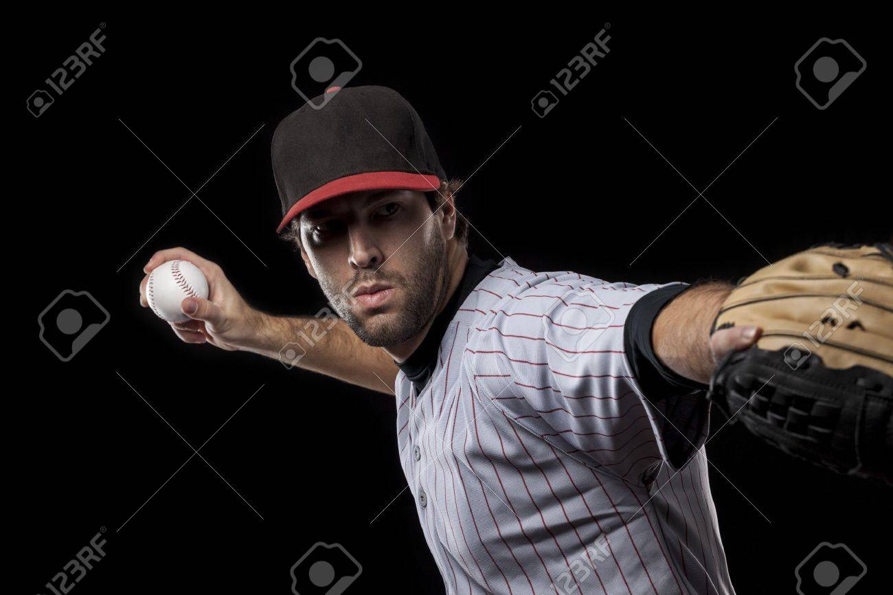 Baseball Player pitching a ball on a black background. Studio Shot. - 19899990 Baseball Player pitching a ball on a black background. Studio Shot. - 19899990