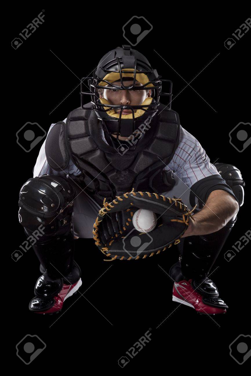 Baseball Player, catcher catching a ball, on a black background. Studio Shot. - 19899972 Baseball Player, catcher catching a ball, on a black background. Studio Shot. - 19899972