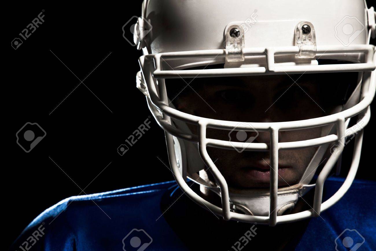 Football Player with number on a blue uniform and a ball in the hand Studio shot - 19905386 Football Player with number on a blue uniform and a ball in the hand Studio shot - 19905386