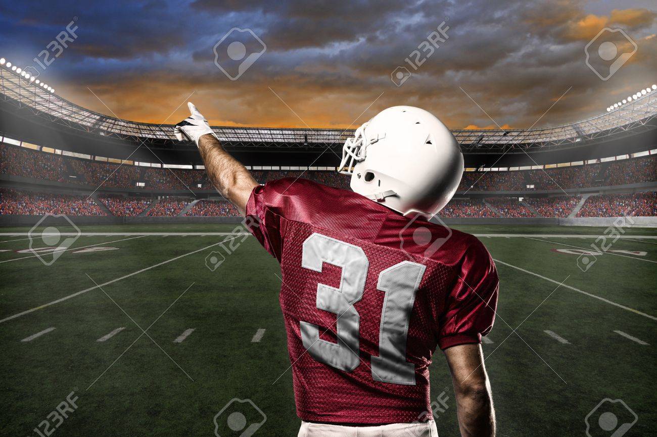 Football Player with a Red uniform celebrating with the fans. - 21782248 Football Player with a Red uniform celebrating with the fans. - 21782248