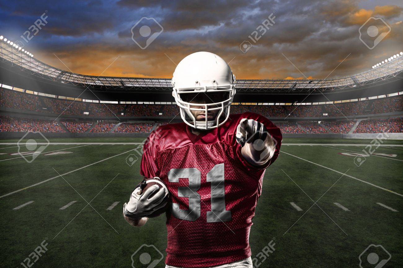 Football Player with a Red uniform celebrating with the fans. - 24352287 Football Player with a Red uniform celebrating with the fans. - 24352287