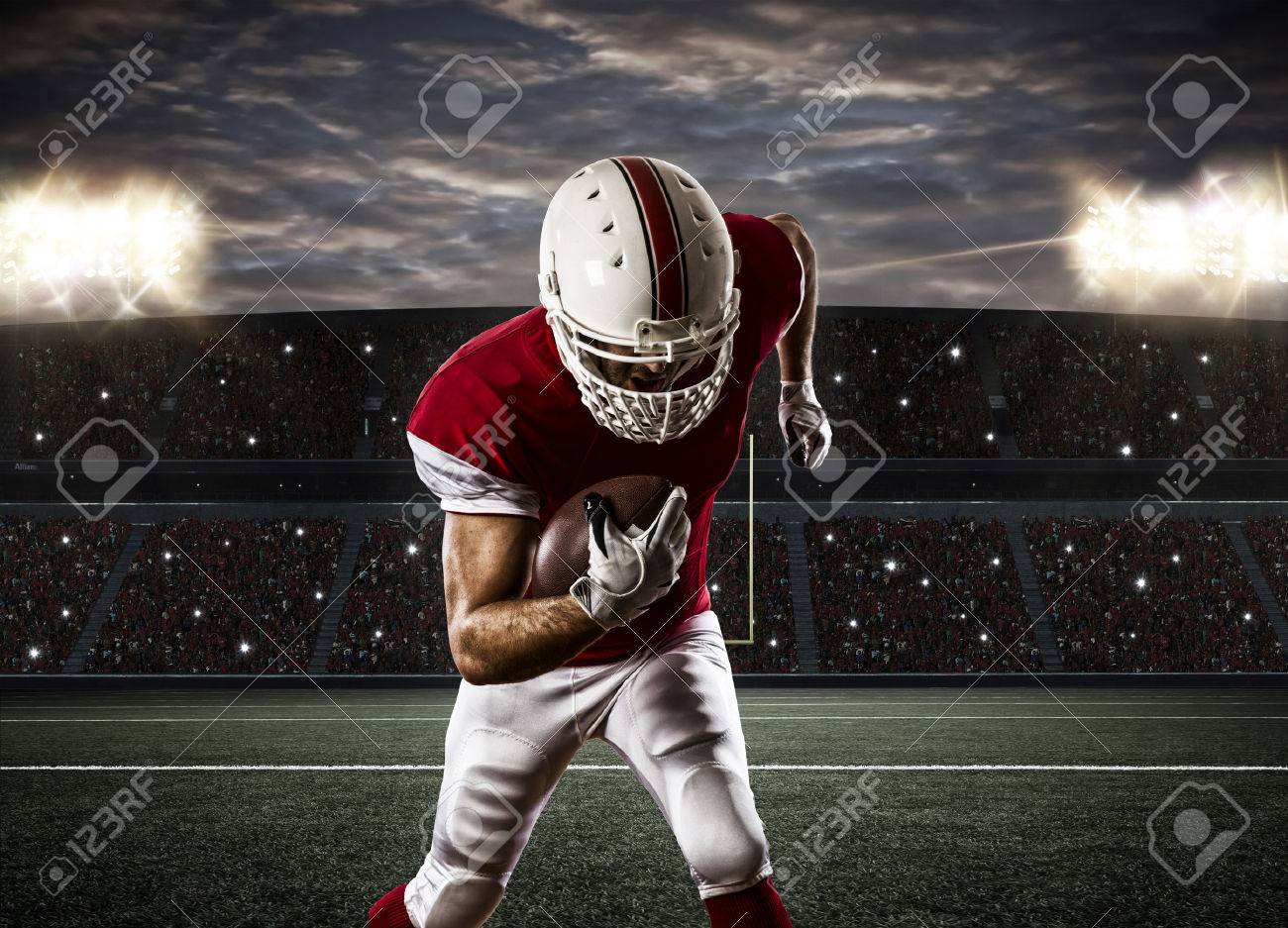 Football Player with a red uniform Running on a Stadium. - 35218425 Football Player with a red uniform Running on a Stadium. - 35218425