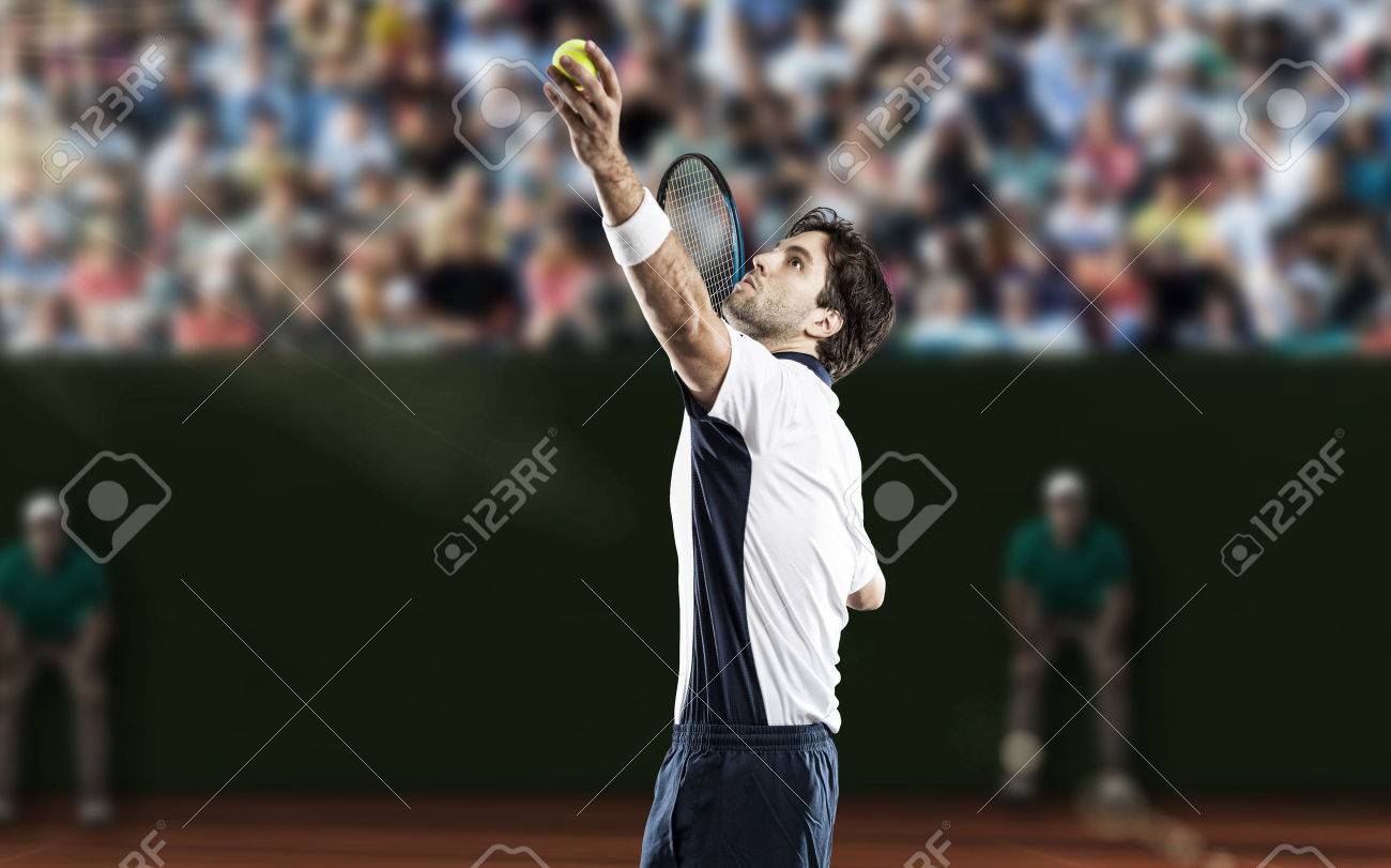 Tennis player playing on a clay tennis court. - 40347923 Tennis player playing on a clay tennis court. - 40347923