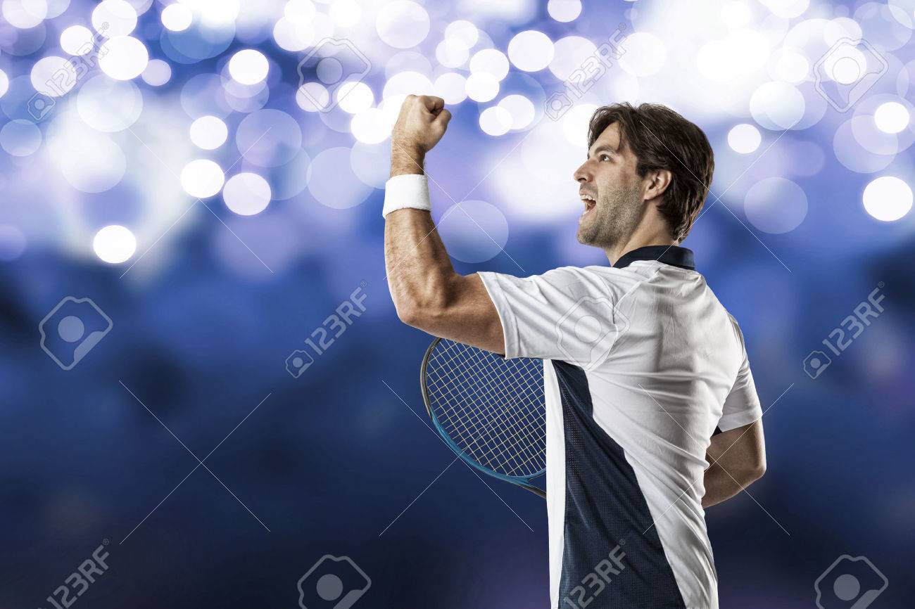 Tennis player celebrating, on a blue lights background. - 40606092 Tennis player celebrating, on a blue lights background. - 40606092