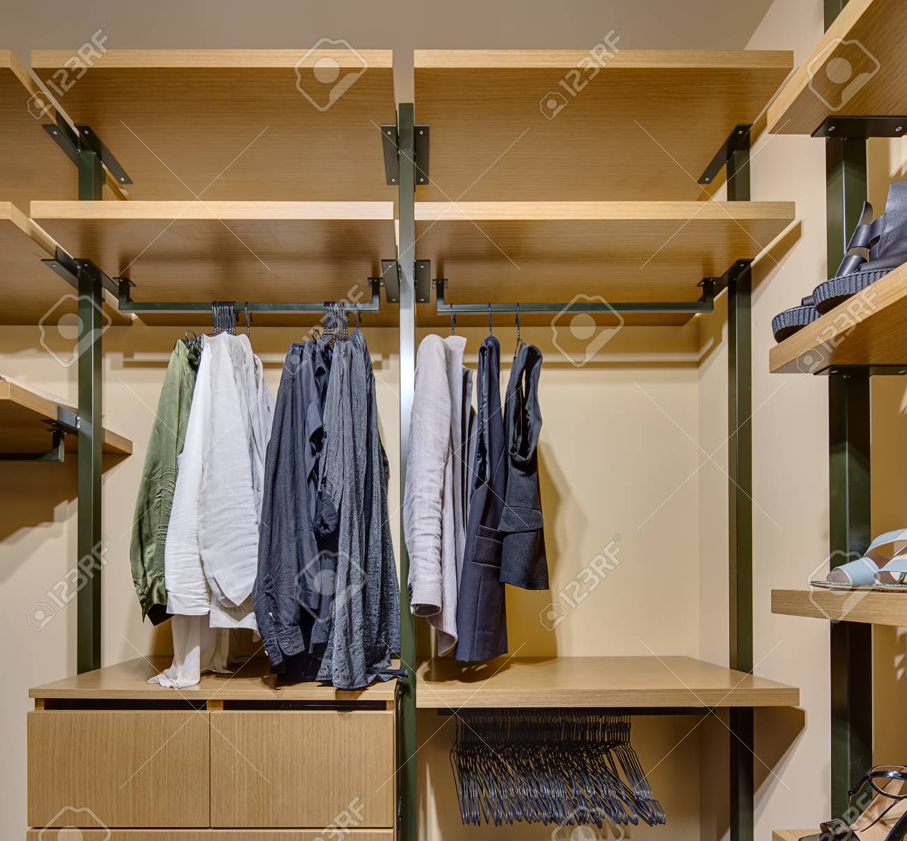 Wardrobe With Wooden Shelves And Drawers On Crossbars Hang