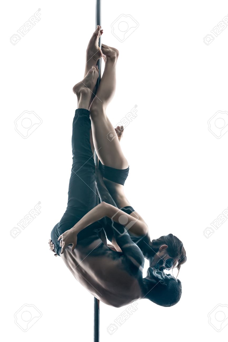 Kissing Couple Of Pole Dancers With Horrific Body Art Which Hanging Upside Down On A Kissing Couple Of Pole Dancers With Horrific Body Art Which Hanging Upside Down On A