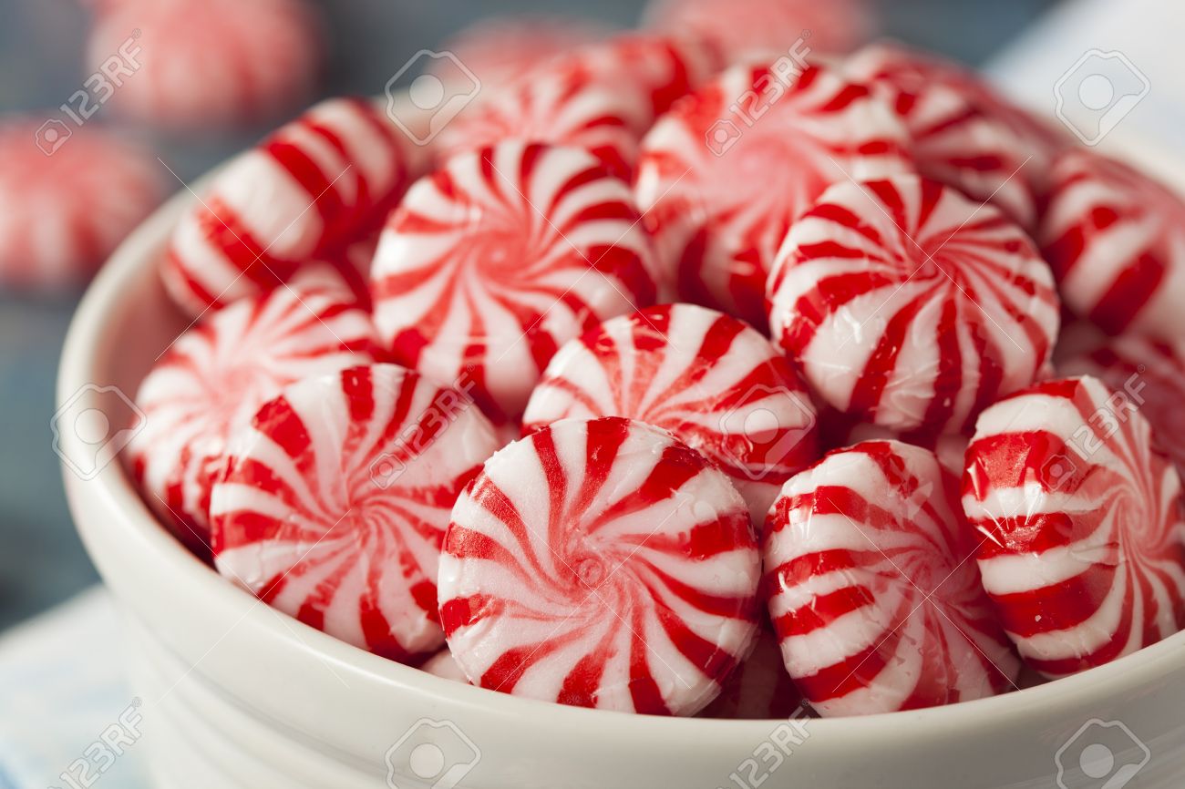 sweet red and white peppermint candy in a bowl stock photo picture