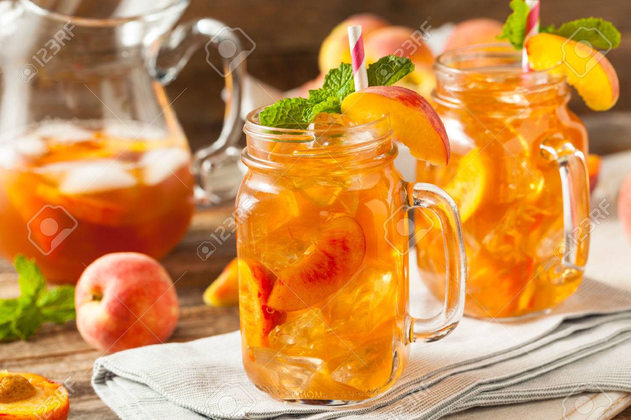fresh homemade peach sweet tea with mint stock photo picture and