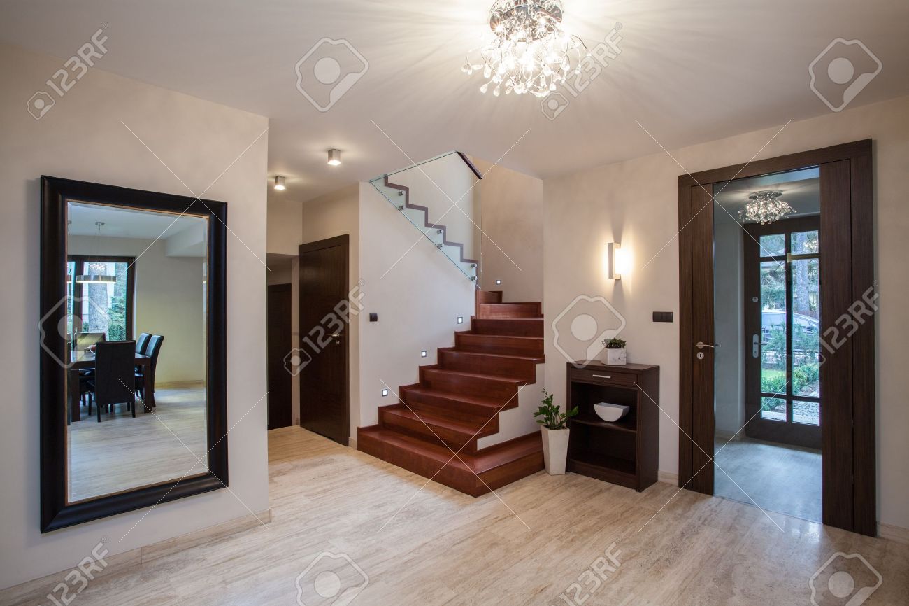 travertine house: interior with hallway, stairs and entrance stock travertine house: interior with hallway, stairs and entrance stock