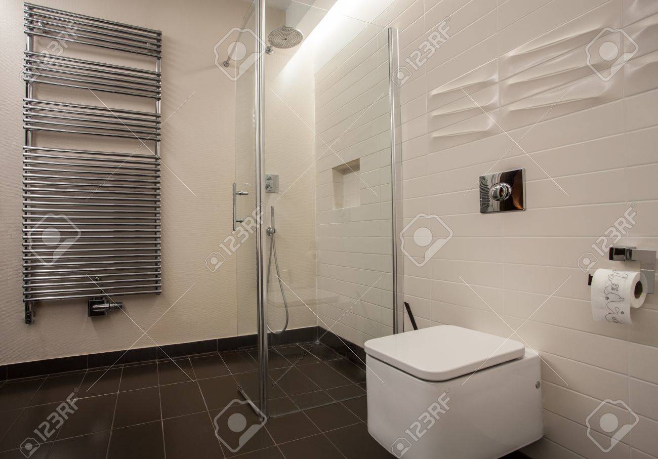 Travertine house bathroom with a modern radiator stock photo
