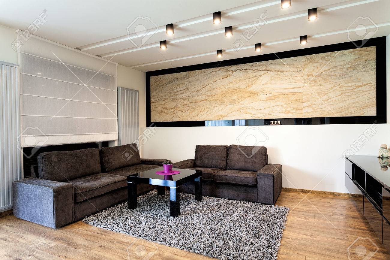 urban apartment - travertine on a wall in living room stock photo urban apartment - travertine on a wall in living room stock photo