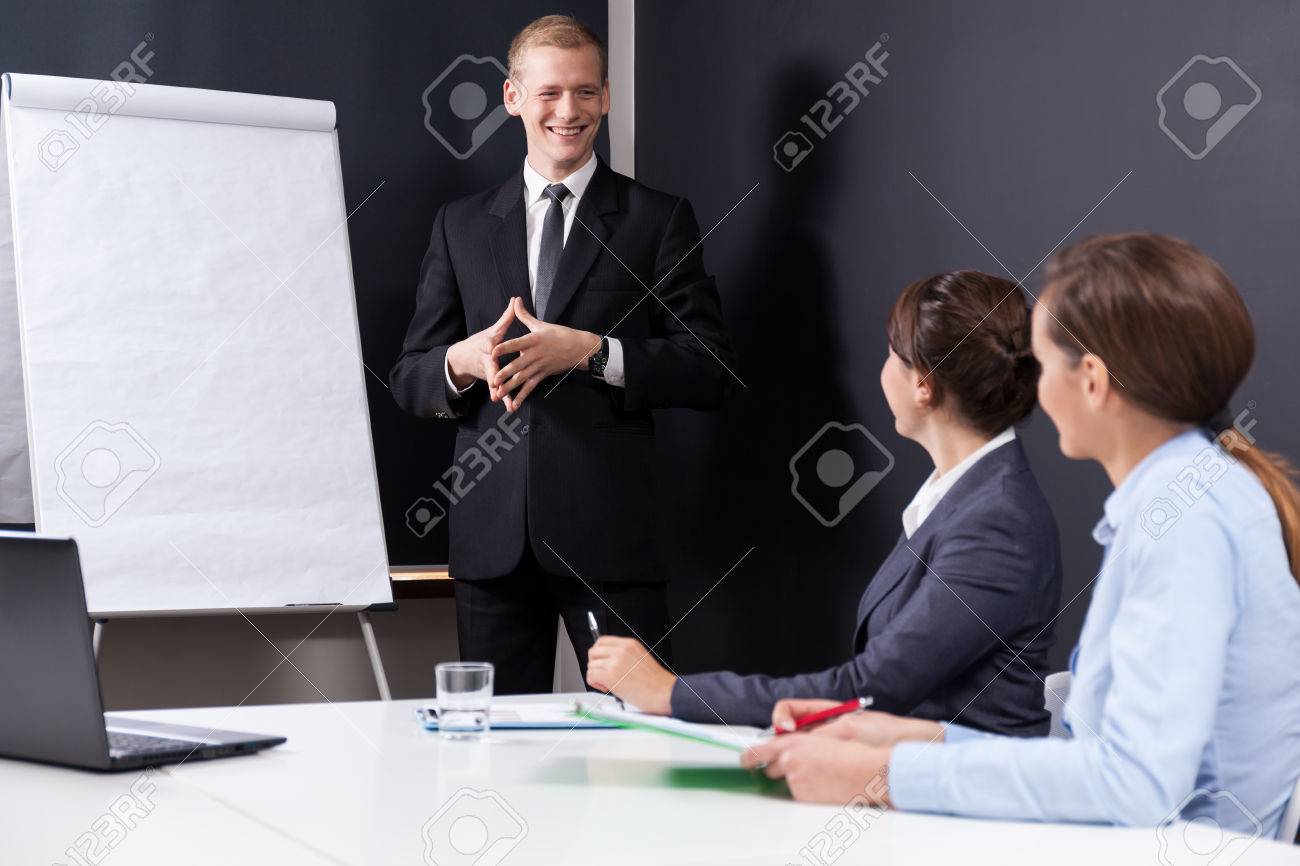 male boss presenting company data at work stock photo picture and presenting company