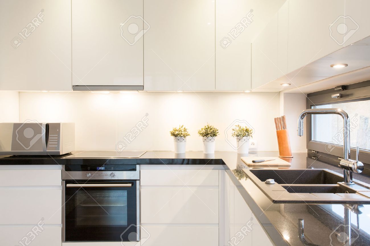 White Kitchen Unit Designs close-up of white kitchen unit in modern interior stock photo White Kitchen Unit Designs close-up of white kitchen unit in modern interior stock photo