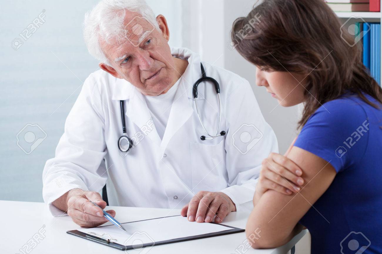 practiced doctor doing medical interview with patient stock photo doctor interview