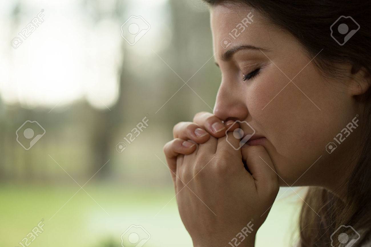 Horizontal view of depressed young woman crying - 41852185 Horizontal view of depressed young woman crying - 41852185