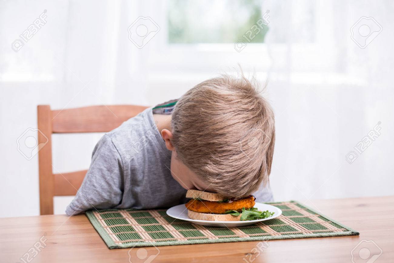 47721329-boy-falling-asleep-and-landing-face-in-food.jpg