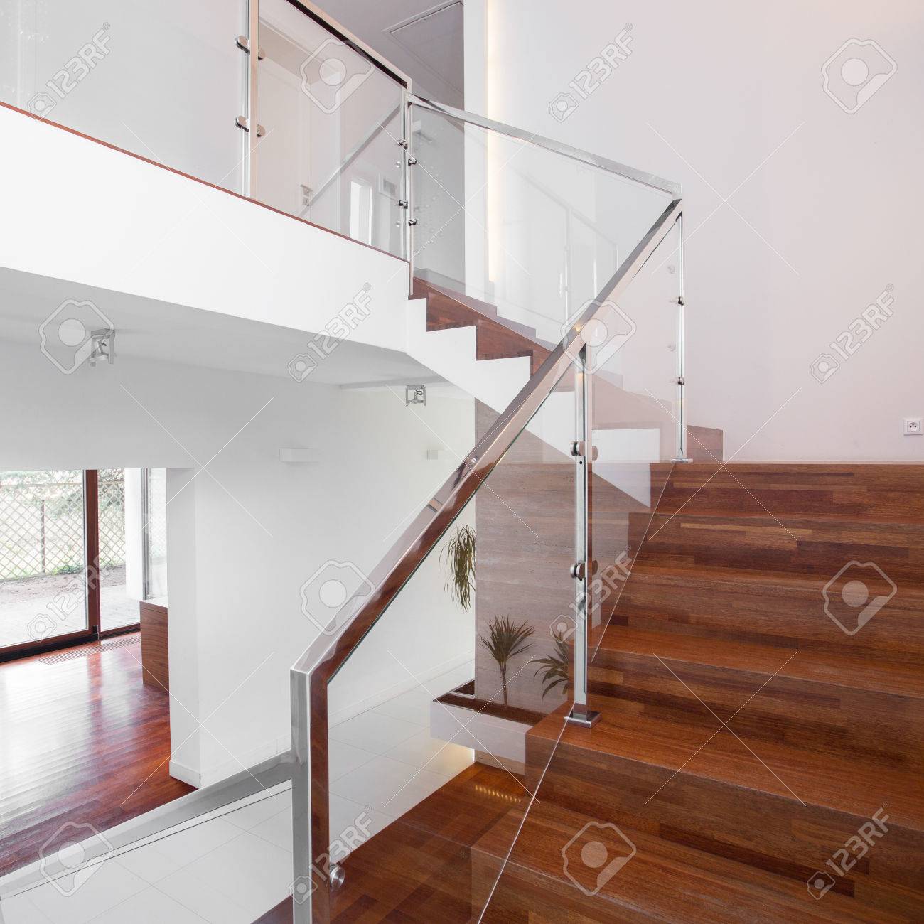 Image Of Solid Wooden Stairs With Elegant Glass Balustrade Stock Photo Picture And Royalty Free Image Image
