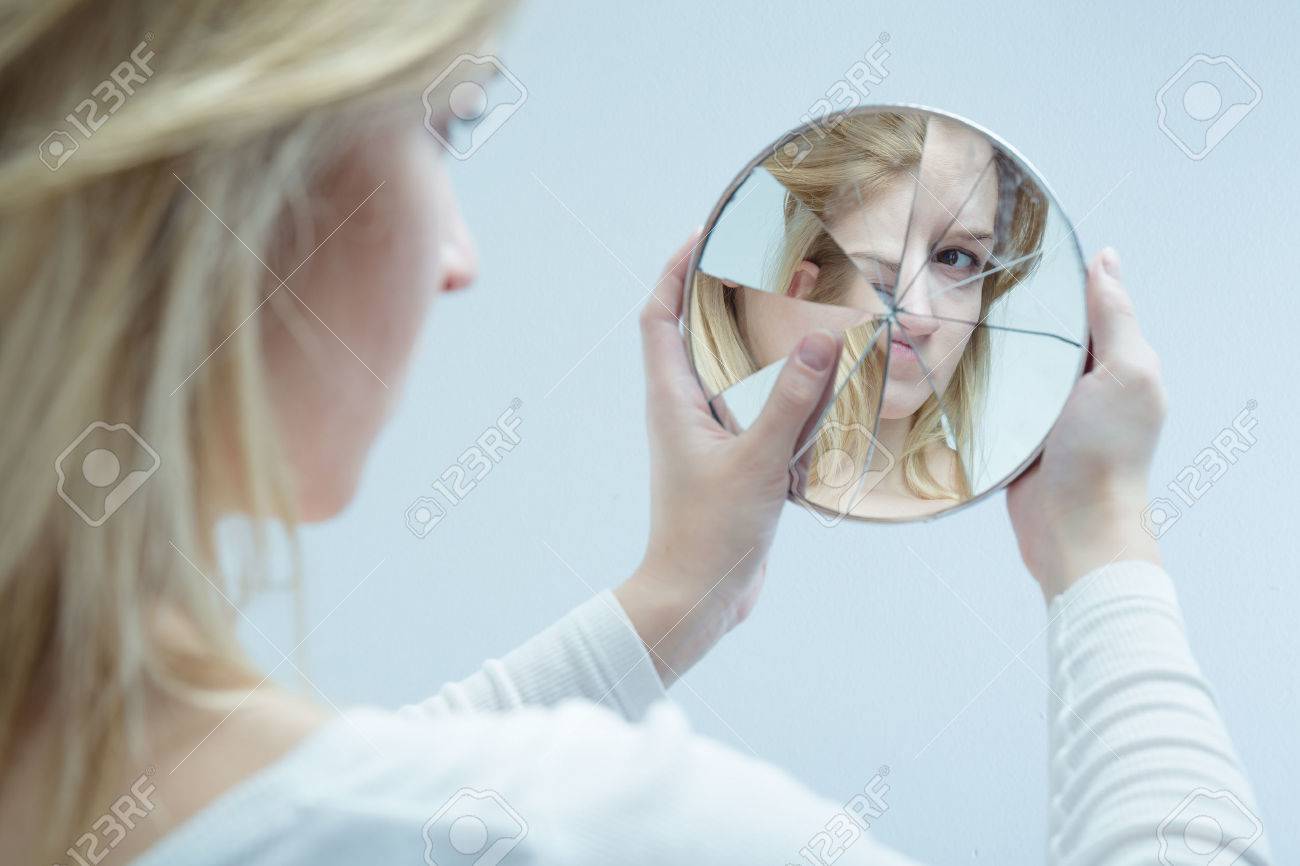 Unhappy pretty girl with complexes and broken mirror - 50351997 Unhappy pretty girl with complexes and broken mirror - 50351997