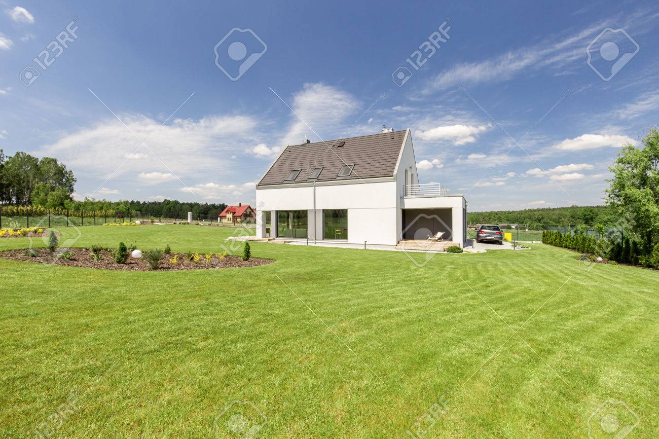 Shot Of A Small Detached House With A Big Garden Stock Photo Picture And Royalty Free Image Image 58408637