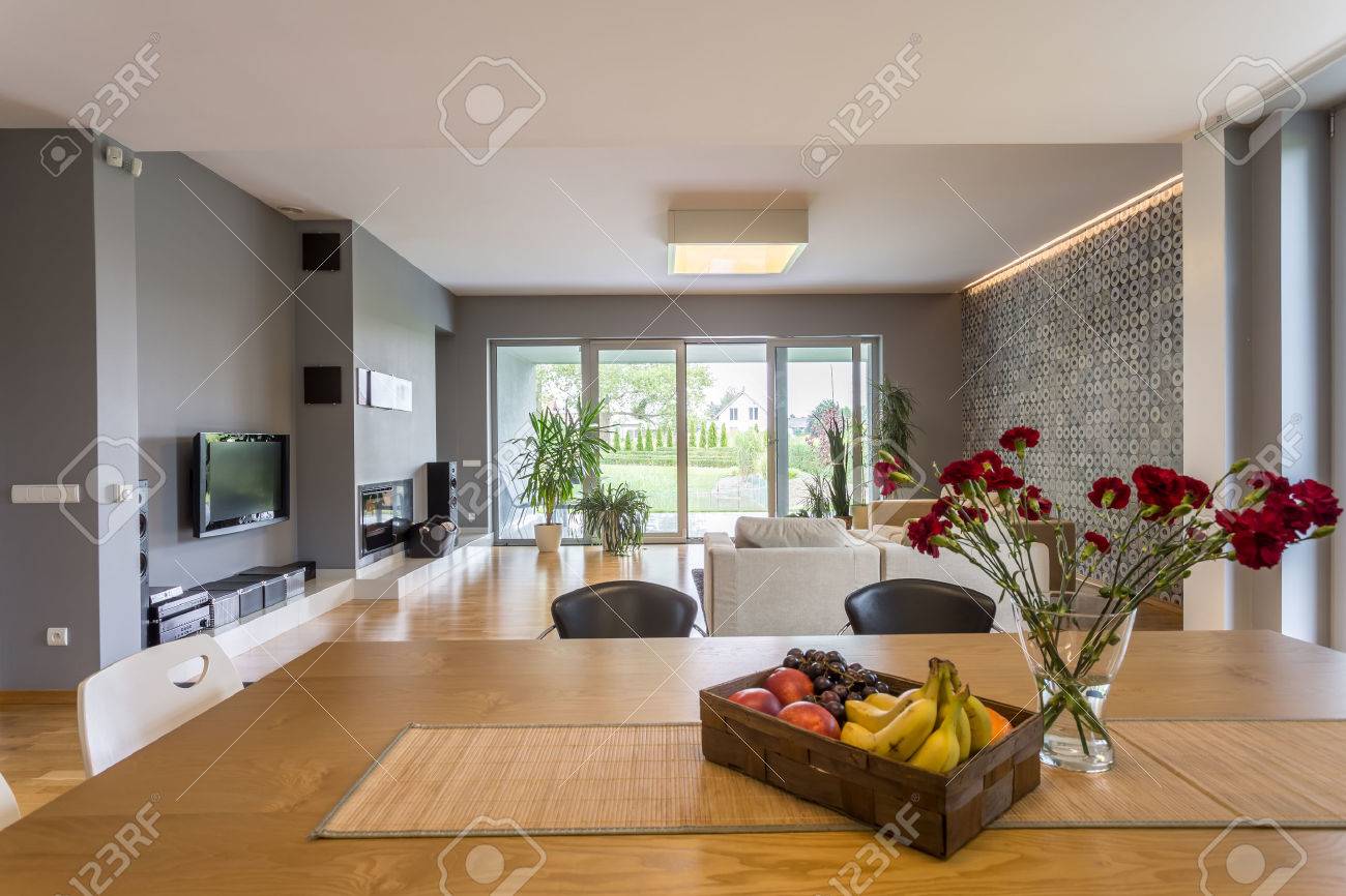 new style open floor plan apartment with dining set and tv living