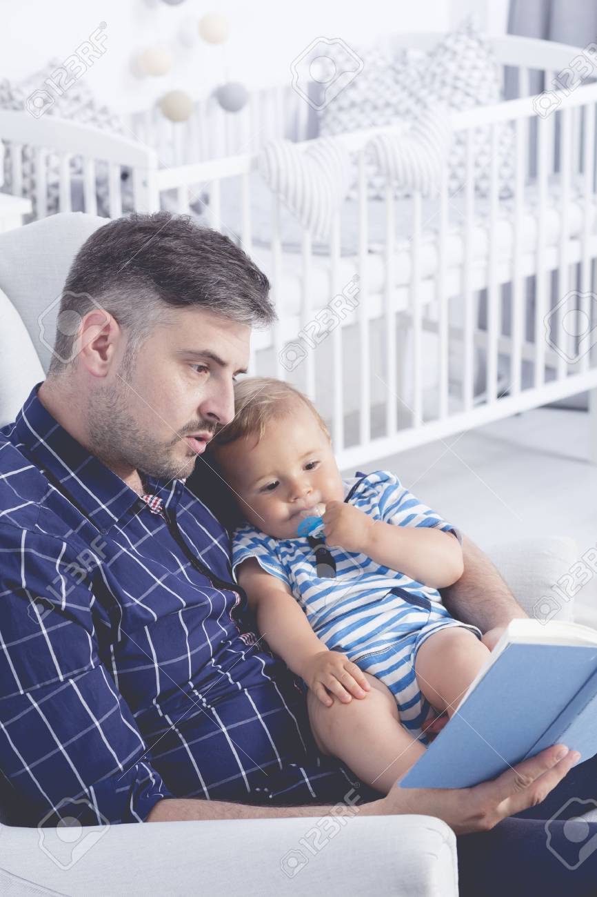 Shot Of A Dad Reading A Book To His Little Baby Stock Photo Picture And Royalty Free Image Image
