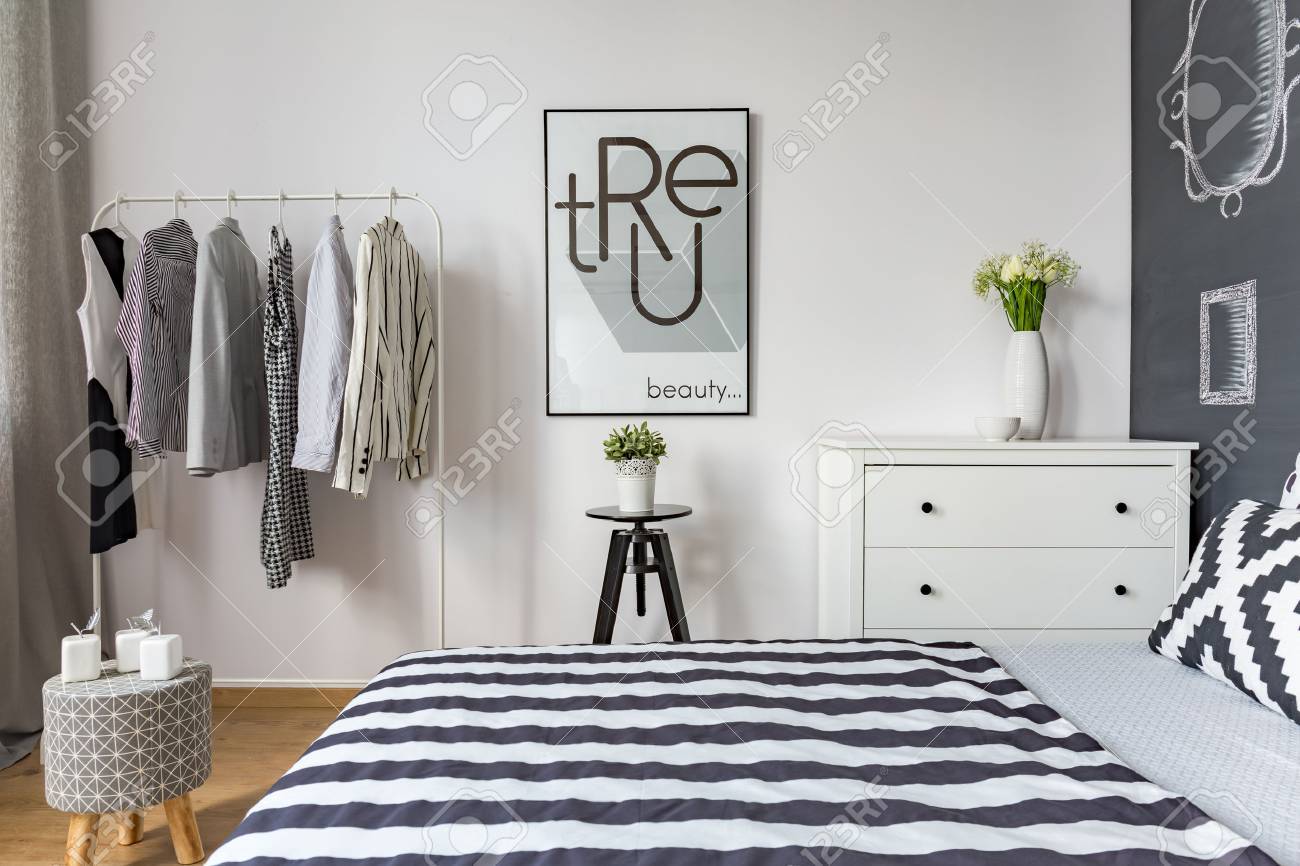 Contemporary Bedroom With Double Bed And Clothes Rack