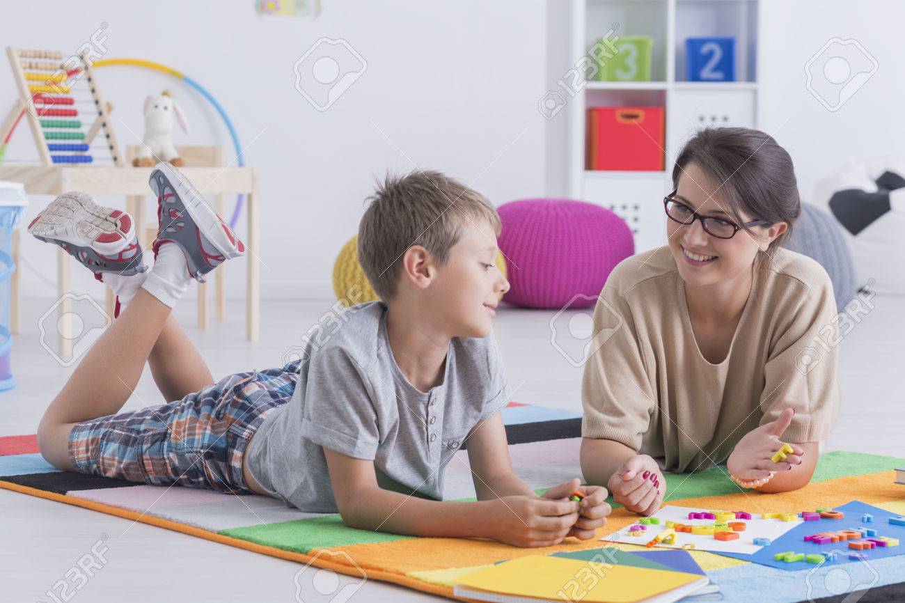 young babysitter taking care of a young boy stock photo picture young babysitter
