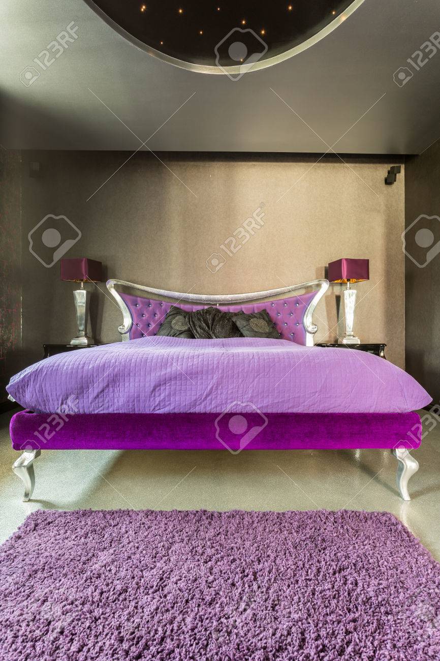 Large Violet Bed In An Extravagant Silver Bedroom