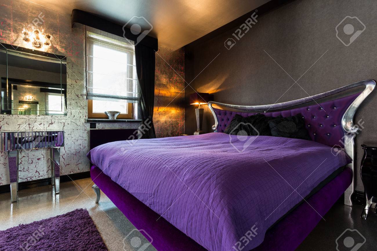 Violet Double Bed In An Extravagant Bedroom With Silver Details