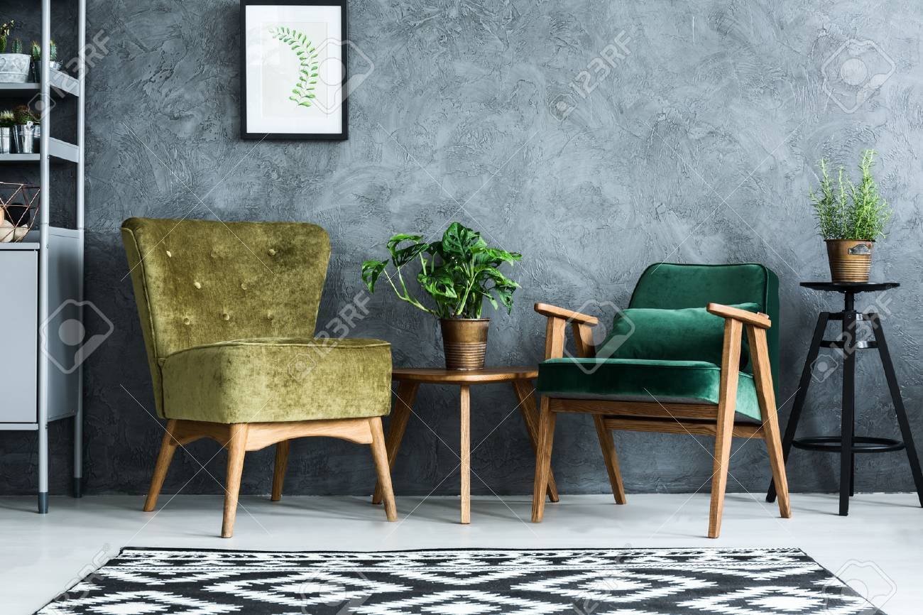 apartment with modern armchairs and cyan wall stock photo 68146823
