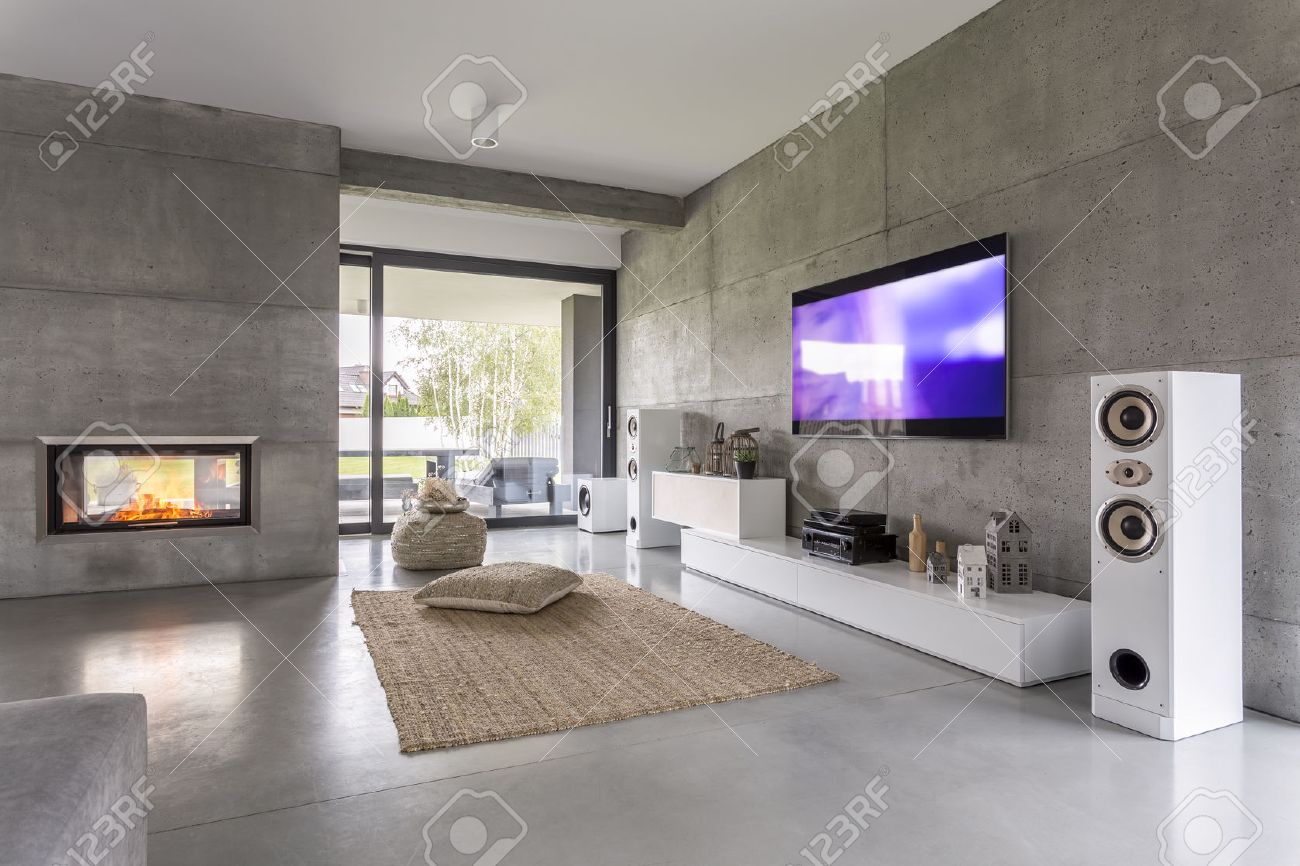 Tv living room with window, fireplace and concrete wall effect - 68553695 Tv living room with window, fireplace and concrete wall effect - 68553695