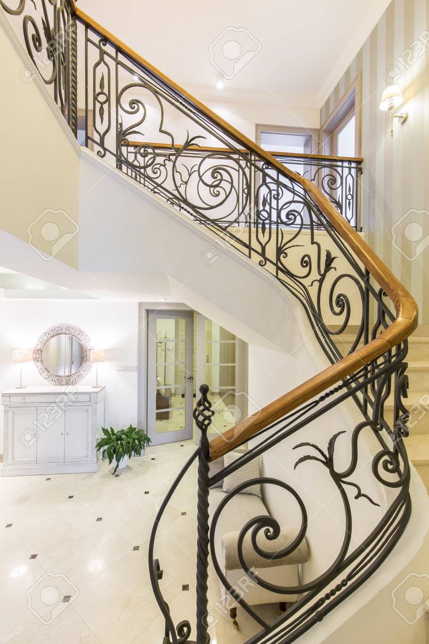 Marble, Elegant Stairs With The Forged Handrail In The Well-lighted Modern  Interior Stock Photo, Picture and Royalty Free Image. Image 71176103., image size:866x1300