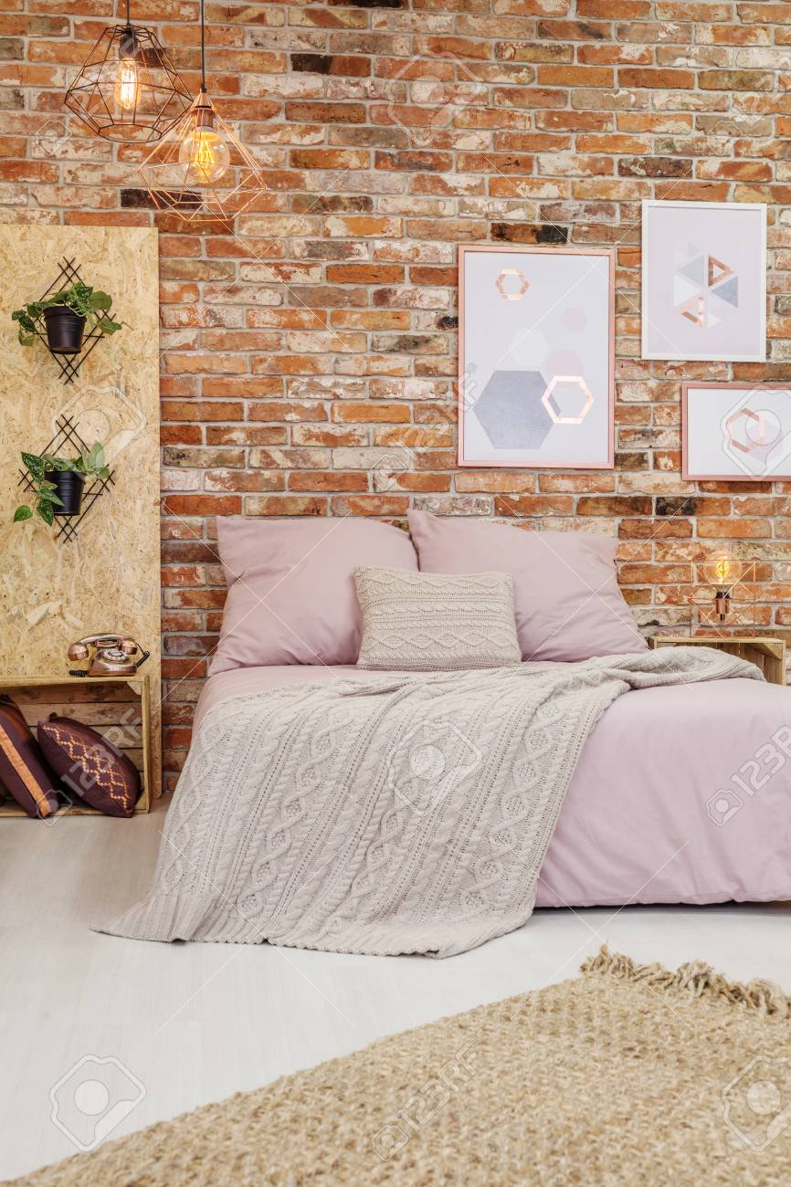 Big Pink Bed With White Blanket In Cozy Bedroom
