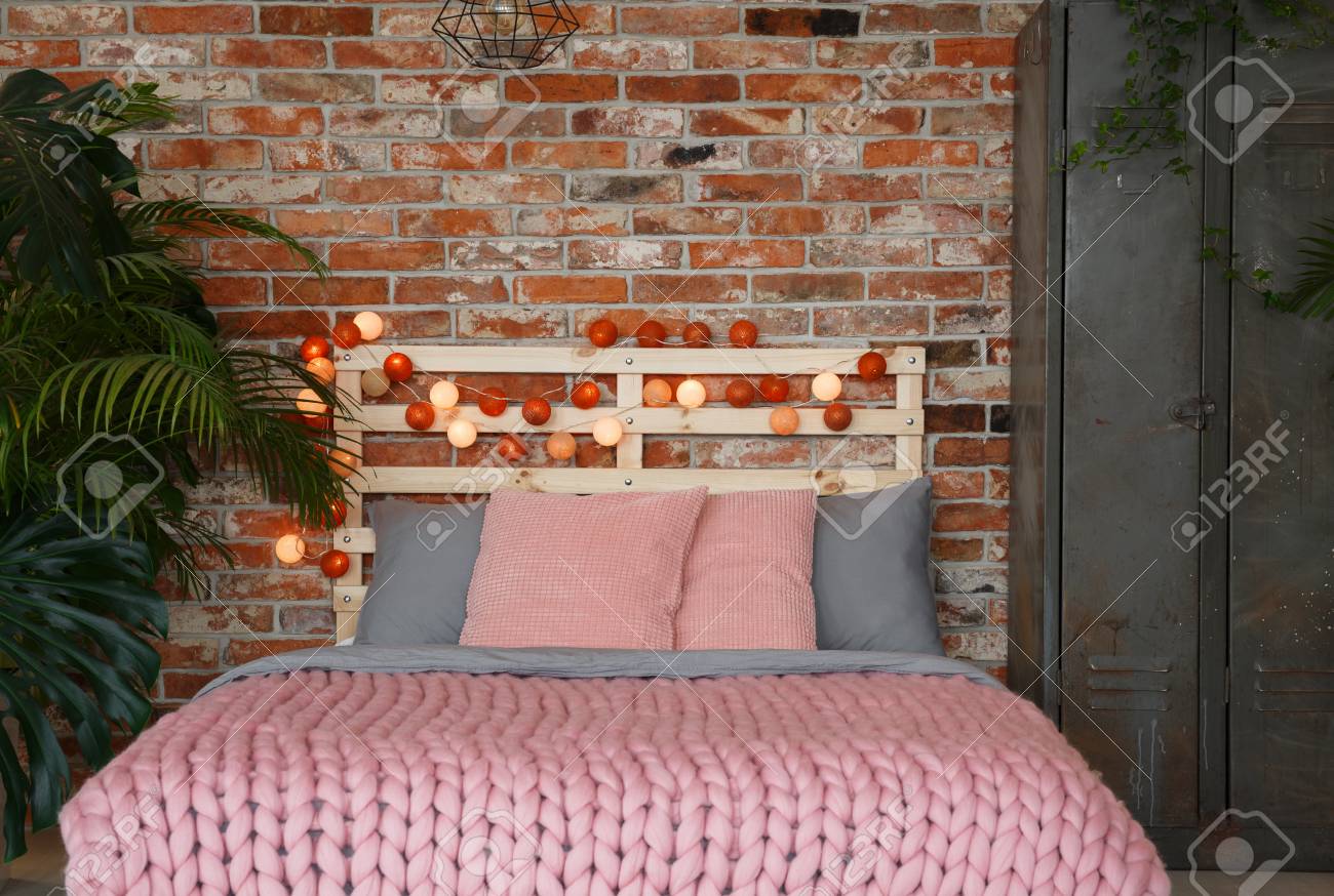Modern Bedroom With Pink Bed Cotton Balls Plants And A Metal