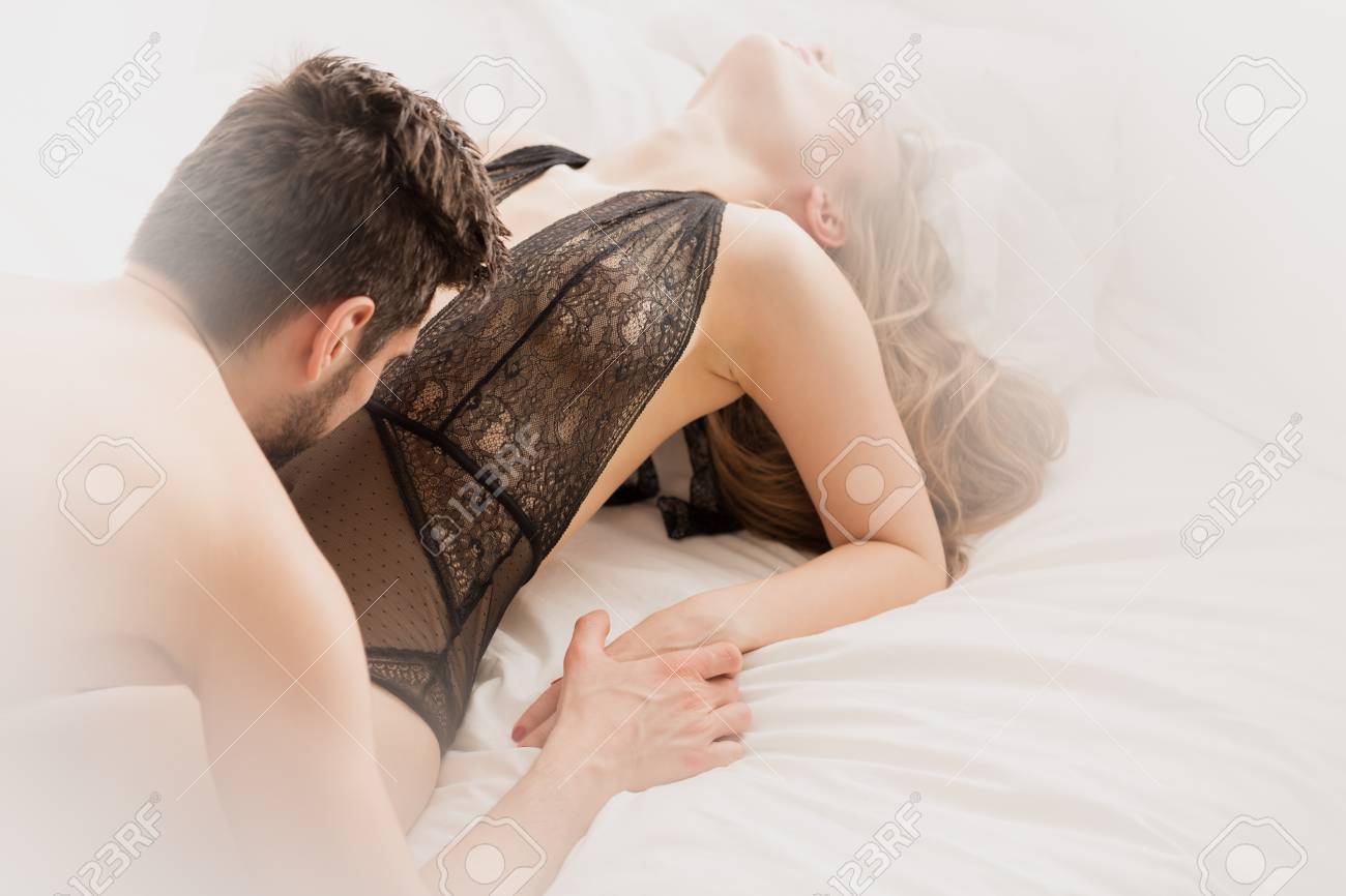 Men and women in bed together