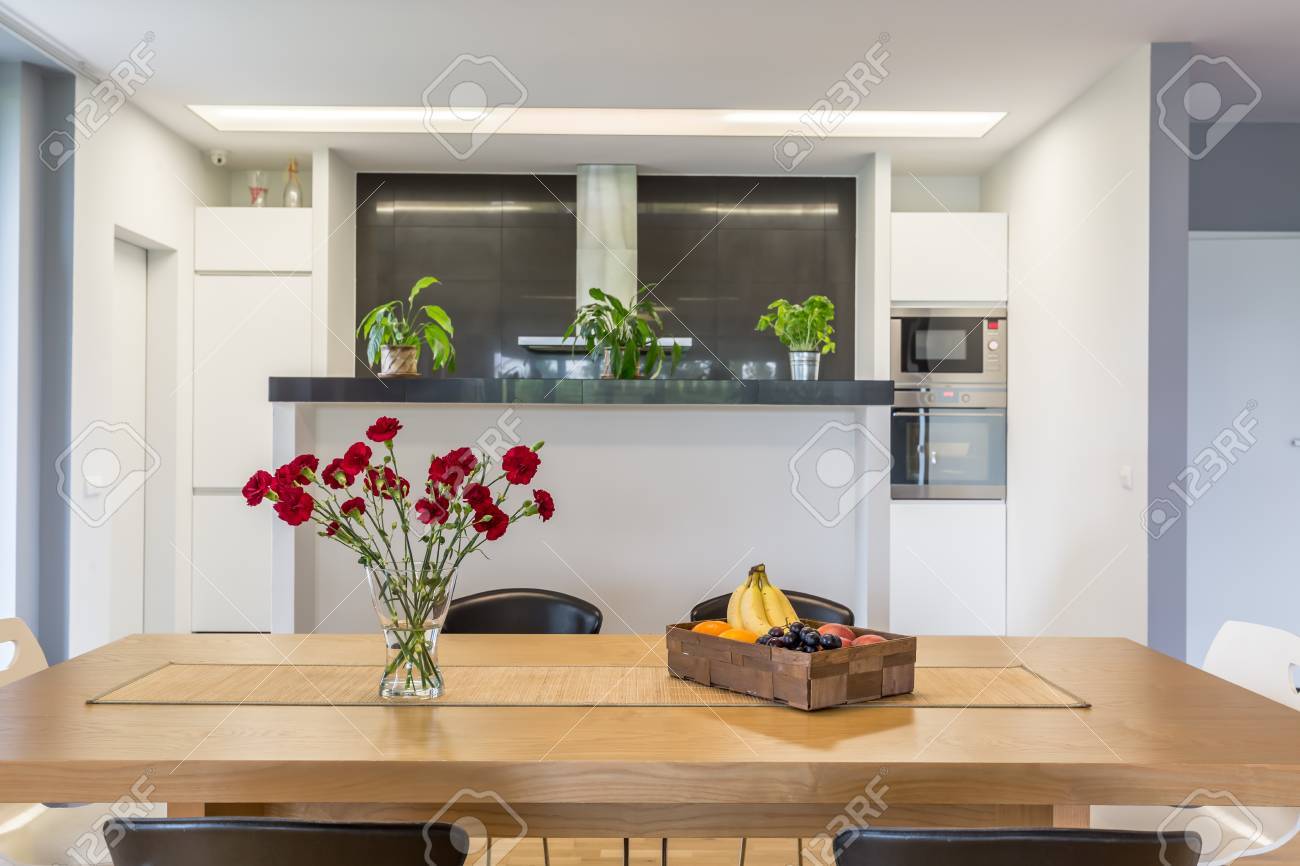 Open Plan Kitchen With The Kitchen Island And Wooden Table At Stock Photo Picture And Royalty Free Image Image 79751864