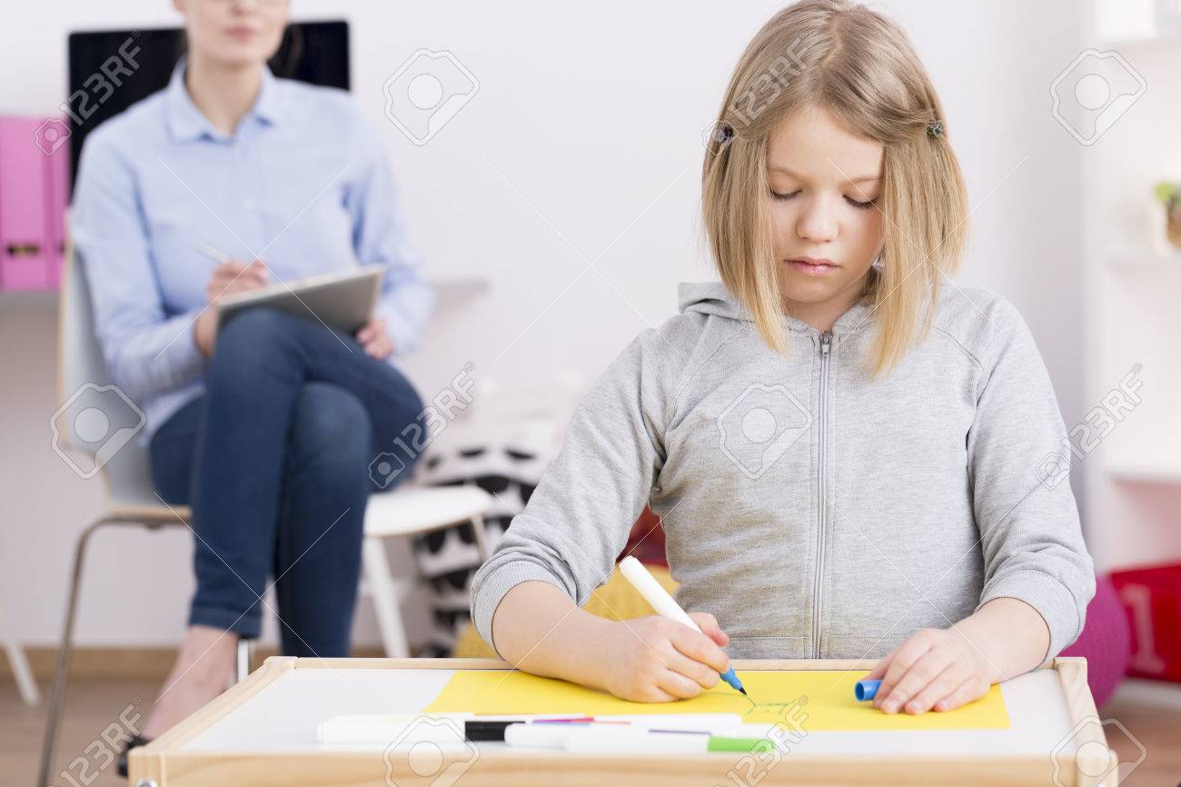 Pediatric Occupational Therapist Observing A Child Patient With