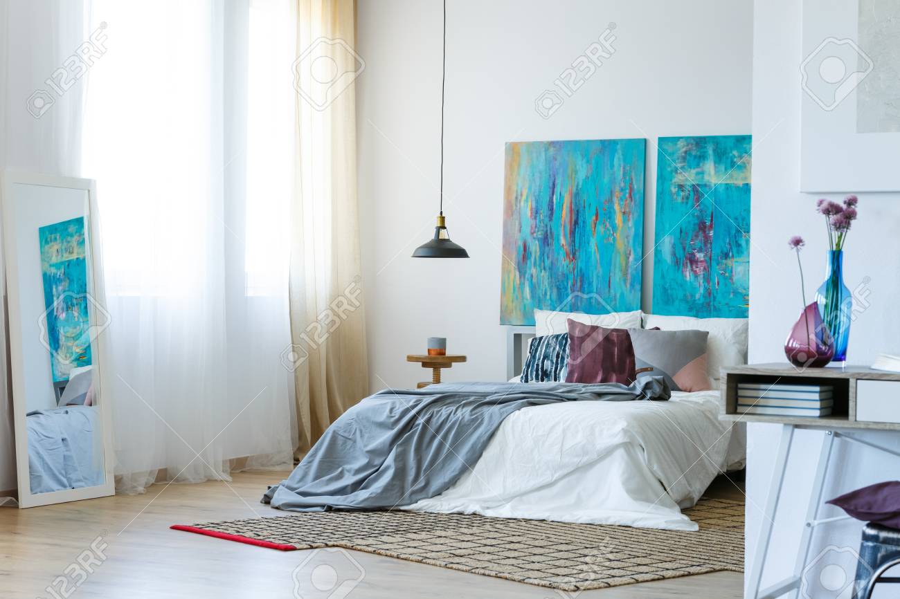 Blue And Purple Accents In Stylish Bedroom