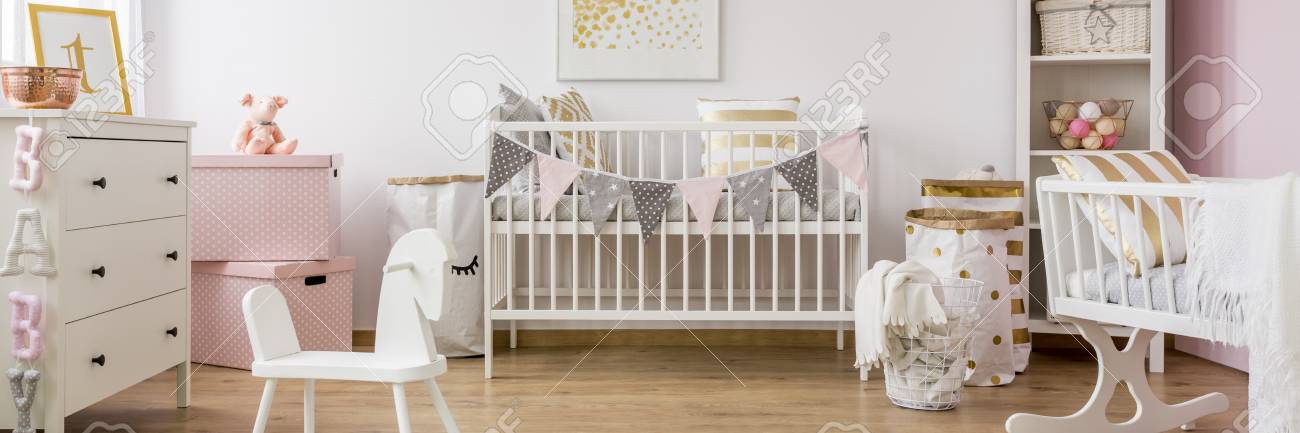 Gold And Pink Baby Room With White Wooden Furniture Stock Photo Picture And Royalty Free Image Image
