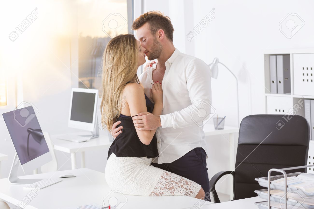 Attractive Man Kissing A Woman At Work Stock Photo Picture And Royalty Free Image Image 84012237