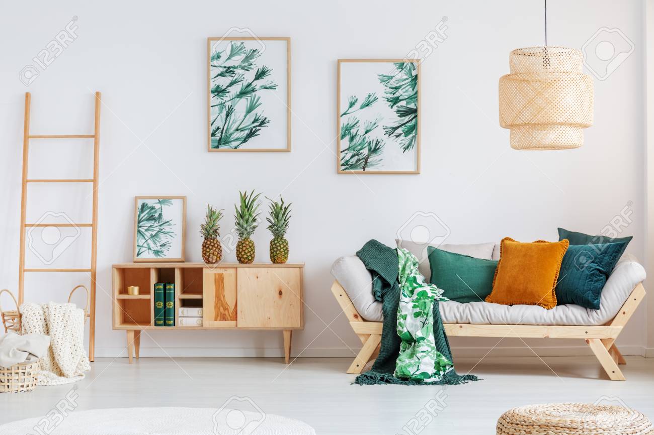 beige couch with pillows