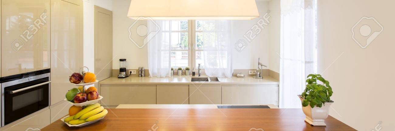 View Of The Kitchen Island With Fruits And Herbs And Worktop