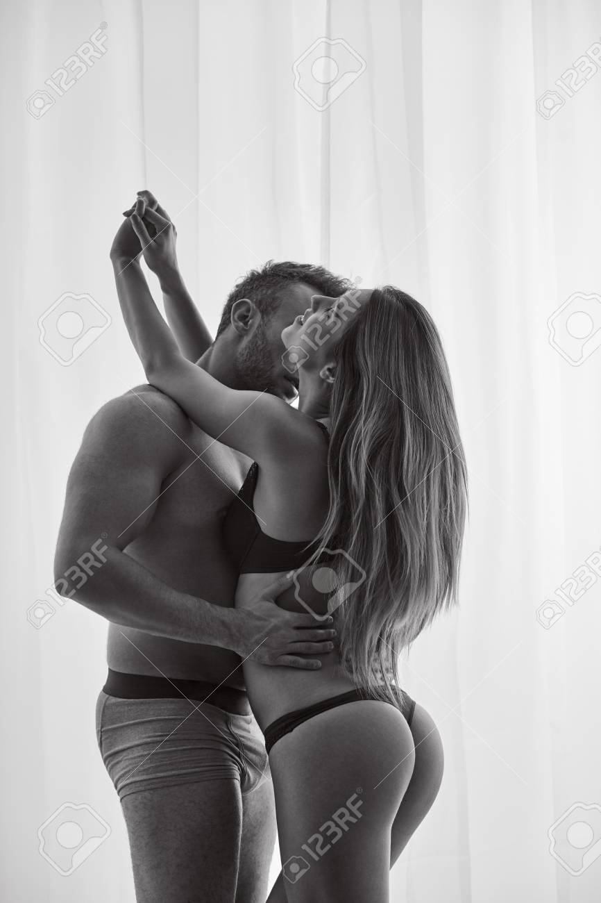 Naked Couple Hugging And Kissing With Passion Stock Photo, Picture And  Royalty Free Image. Image 87763654.