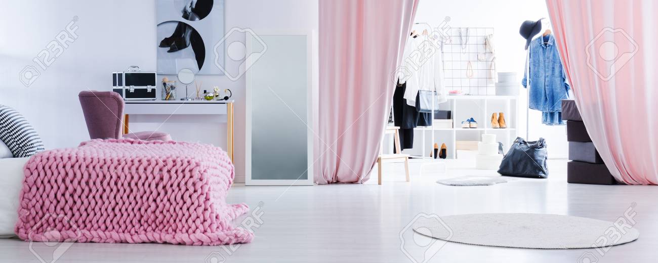Bright Ladies Bedroom With Open Walk In Wardrobe With Designer
