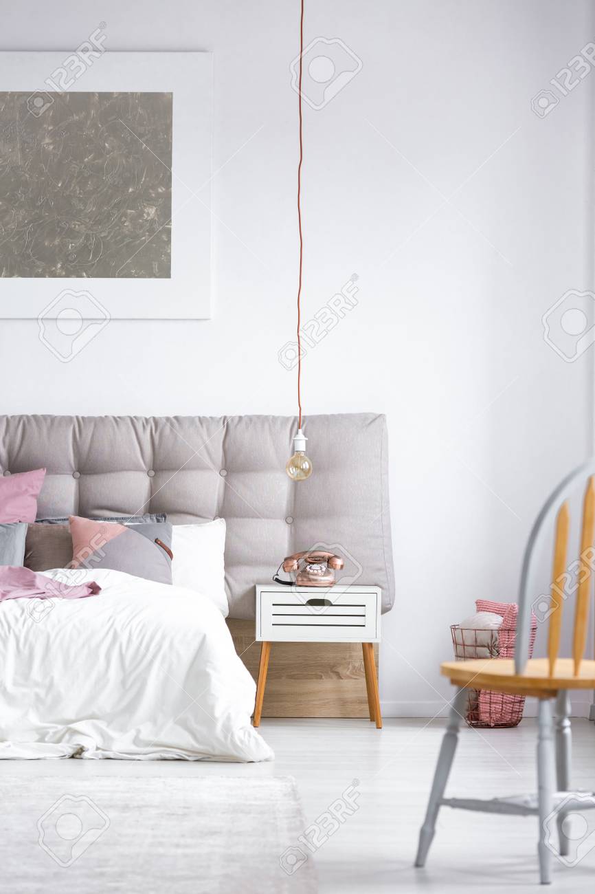 Old Styled Copper Phone And Vintage Pendant Light Bulb Next In Old Styled Copper Phone And Vintage Pendant Light Bulb Next In Cozy Bedroom With Big Gray
