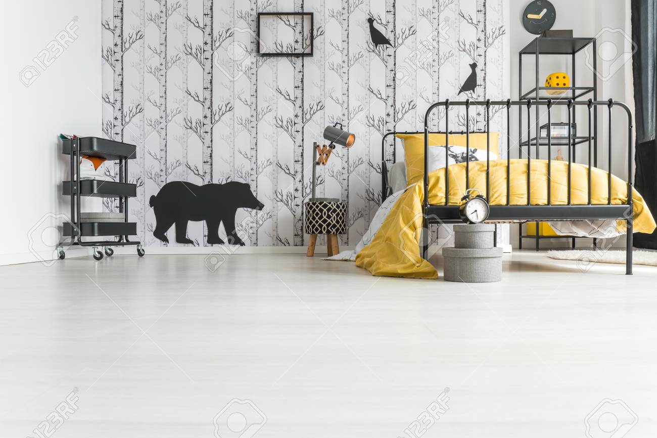 Poster On Easel And Yellow Lamp Above Carpet In Bright Kids Room With Plant And Clock Real Photo Stock Photo Download Image Now Istock