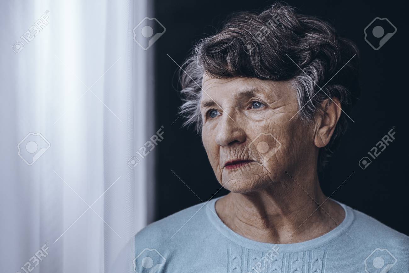 Elderly woman with memory problem spending time in nursing home - 90323723 Elderly woman with memory problem spending time in nursing home - 90323723