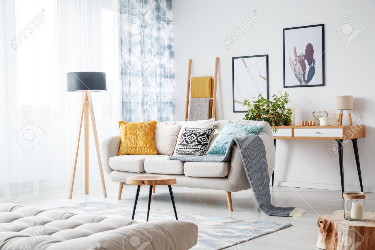 beige sofa grey cushions