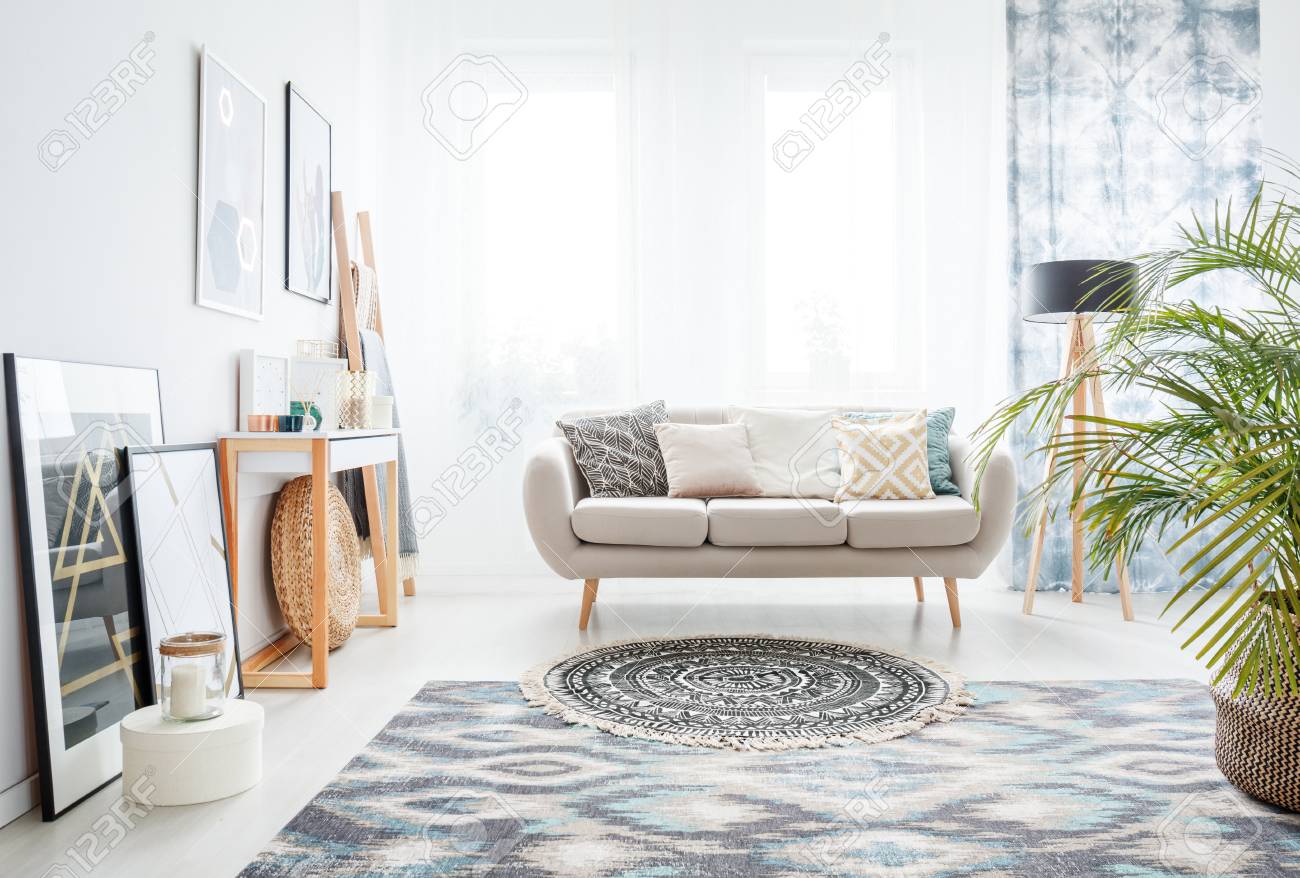 beige sofa with blue pillows
