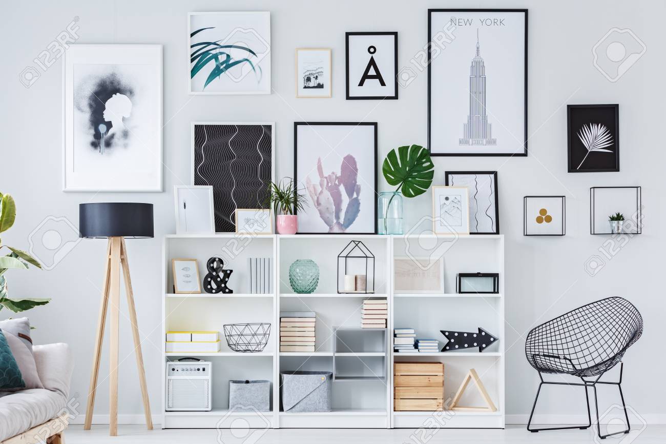 Wooden Shelves With Decorations Boxes And Books In White Living